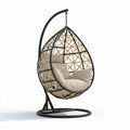 Hanging egg chair with cushion in beige woven rattan and metal frame